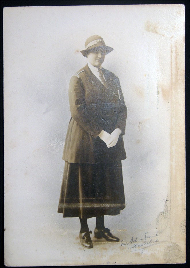 Item #028470 Circa 1915 Cabinet Card Photograph of a Uniformed Woman Wearing a Red Cross Lapel Pin, By Ash & Dunk Maidstone. Great Britain - 20th Century - Photography - Medicine - Red Cross - Maidstone - Ash, Dunk.