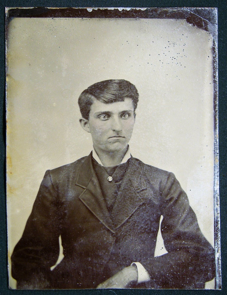 Item #029727 Circa 1880 Tintype Photograph of a Somewhat Cross-eyed & Staring Young Man; or a Woman with a Man's Hairstyle? Americana - 19th Century - Photography - Tintype - Androgyny.