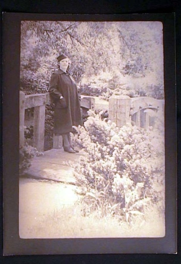 Item #17390 C. 1930s Photograph of Pregnant (?) Woman (or) a Woman in a Coat That is Tailored in a Manner That Makes Her Look That Way. Photography.
