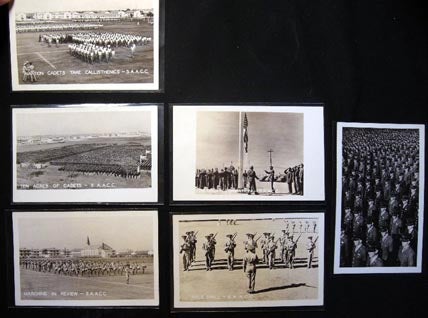 Item #20346 C. 1944 Group of 6 Real-Photo Postcards of the San Antonio Aviation Cadet Center: Rifle Drill, Marching in Review, Retreat Formation, Taking Callisthenics, 'Ten Acres of Cadets' Standing on Parade Review; and a Closer Group Photograph of Cadets. San Antonio Aviation Cadet Center.