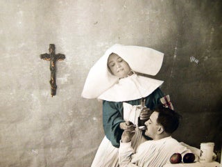 Circa 1916 "Charite" Real Photo Postcard with Hand Coloring & Gold Highlights of a French Nursing Sister Giving a Patient Medicine
